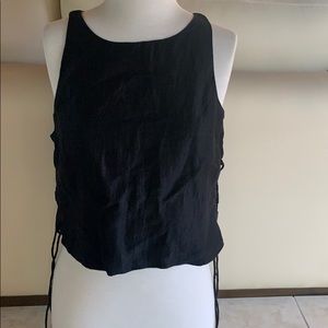 Black top with tie design on both sides.